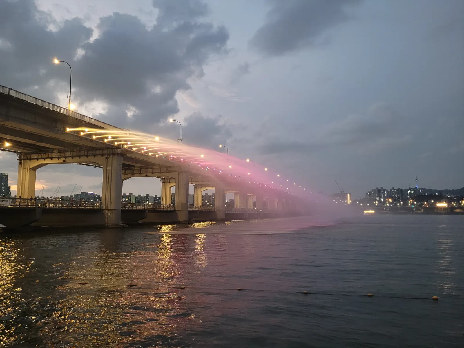 The Han River fountain glowing at dusk